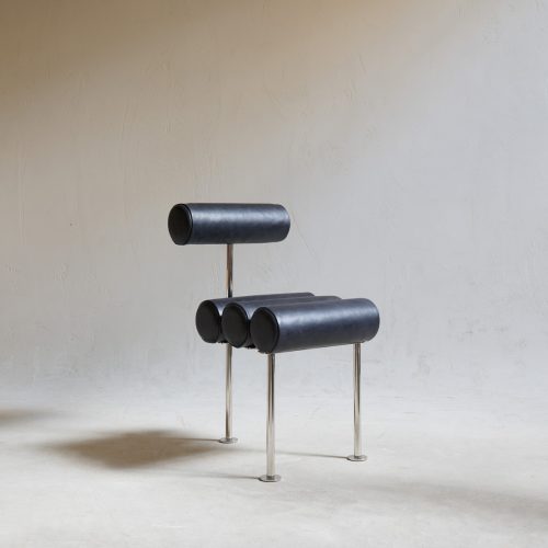 Silla de comedor de acero y piel